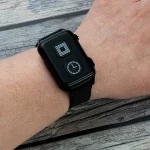 Our fall detection watch with a clock and alarm call/cancel button visible